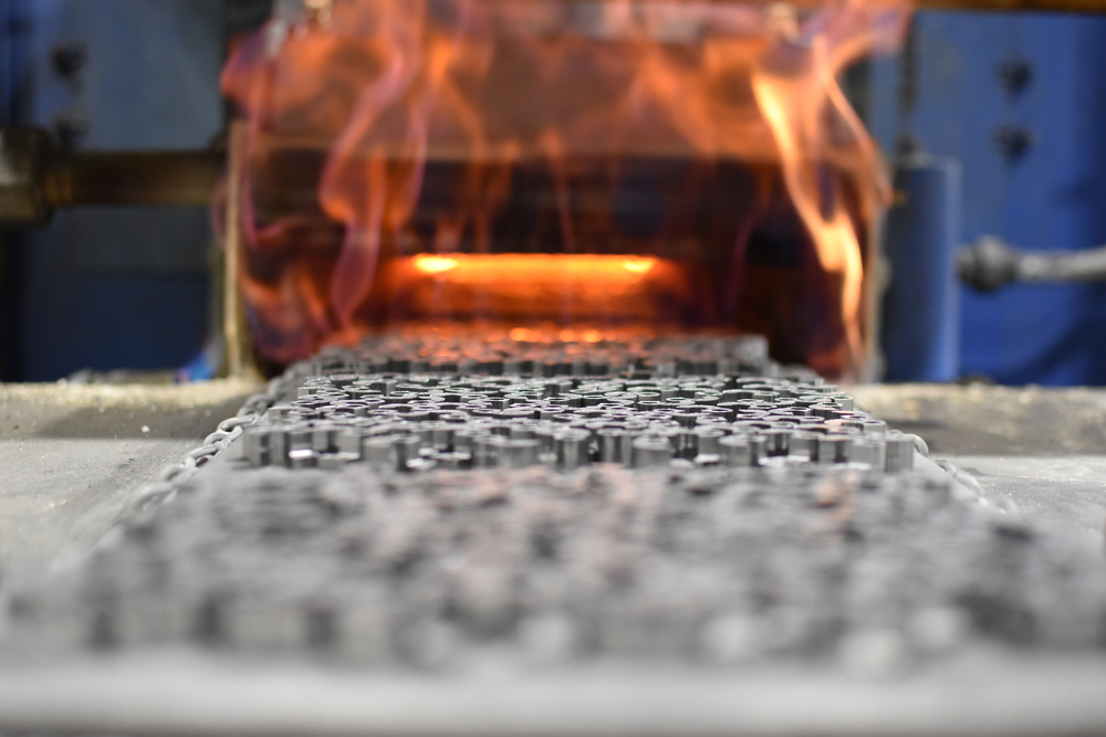Powder metal components moving into furnace